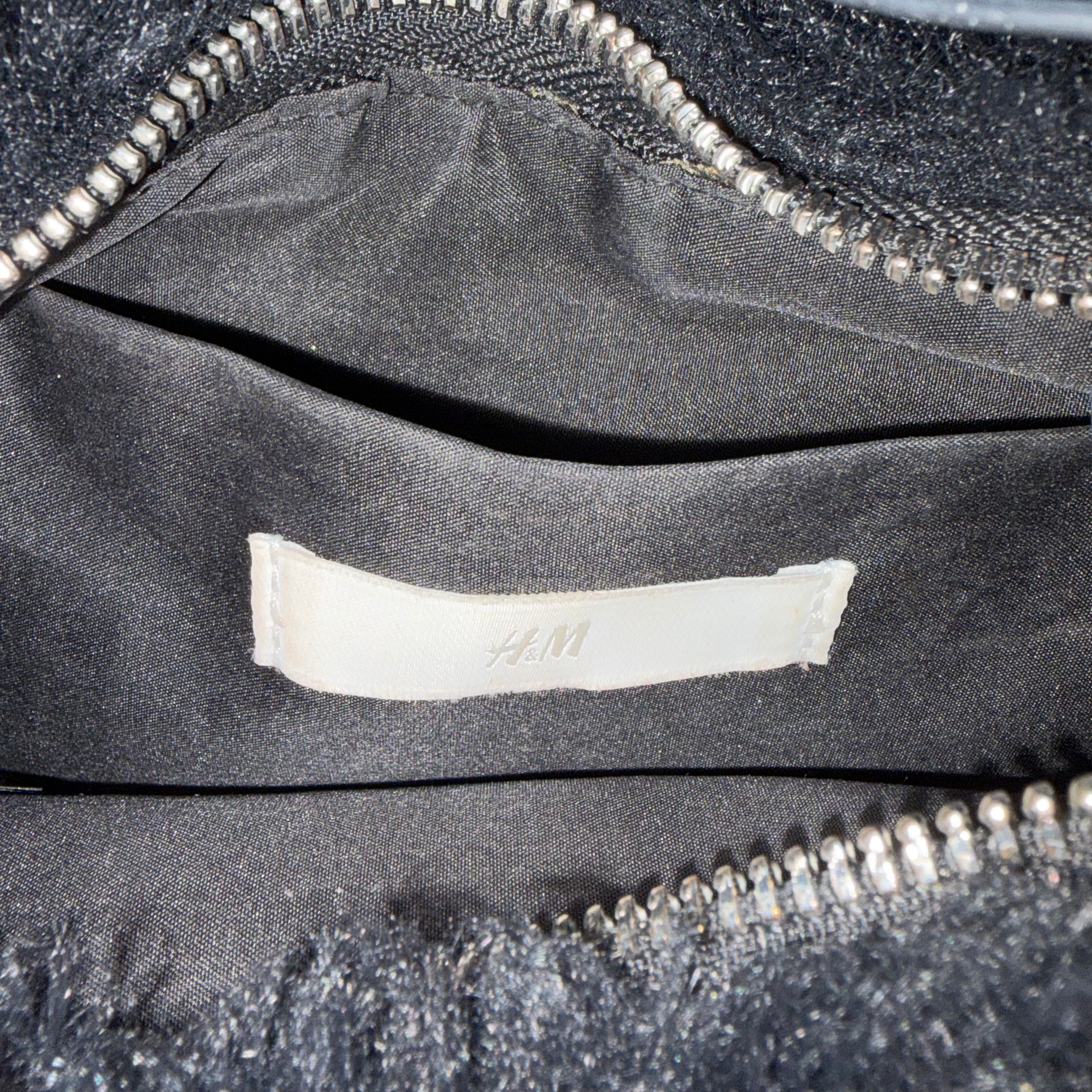 black fur bag with faux leather straps